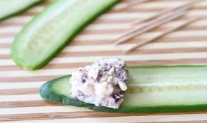 Place a spoonful of the filling on the end of the cucumbers.