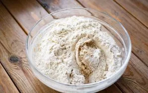 Then add flour and soda to the oat mixture. Mix everything very quickly with your fingertips and collect in a ball, you should do this in...