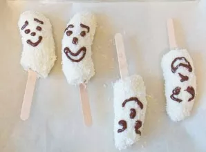 Make ghost faces out of melted dark chocolate. Put them in the fridge for ~4 hours.