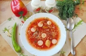 Borscht with young cabbage and sausages to prepare. Delicious!