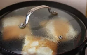 Beat the egg, dip each pancake in it, roll in flour and fry in a pan (I cook under the lid) on both sides until golden brown.