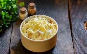 Sprinkle with Adyghe cheese. Bake in the oven for 15 minutes at a temperature of 180 degrees.