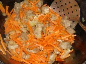 Now lets add the carrot strips. Mix everything and fry. Cook until the carrots are browned or tender. Again, as you like.