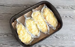 Put the prepared fish in the oven, heated to 180 degrees, for 25-30 minutes.