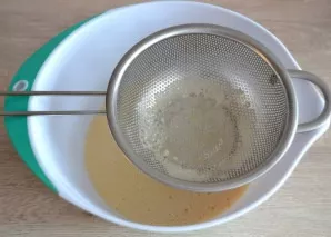 Strain the milk-egg mixture, preferably twice.