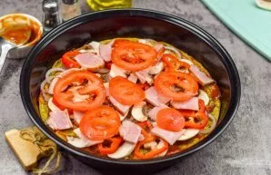 Then add mushrooms, peppers and tomatoes, as well as bacon.