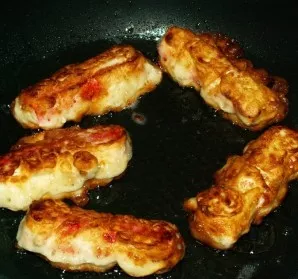 Fry the dough on both sides until golden brown.