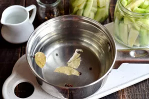 Drain the liquid into a saucepan, prepare the marinade. Add the required amount of salt and sugar, add peppercorns and bay leaf. Boil the...