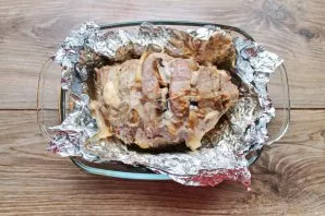 Put the meat in foil in a baking dish, pour a little water on the bottom. Place in a hot oven and bake at a temperature of 180 degrees fo...