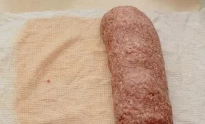 And carefully, lightly pressing it, twist everything into a roll.