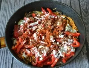 Add spices: paprika, ground chili pepper, ground coriander, add starch and sugar.