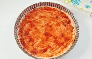 Divide the dough into two parts. On a floured surface, roll out thinly and carefully transfer to a greased baking sheet. Form small sides...