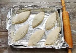 Form patties and place the seam down on a greased baking sheet or on baking paper. Cover with a towel and leave to rise for 10-15 minutes...