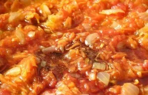 Pour wine into the pan. Simmer over high heat. Then reduce the heat and simmer for another 5 minutes.