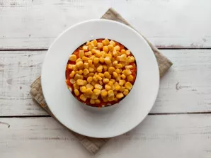 Sprinkle the salad with corn.