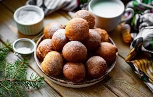 Cool the prepared donuts, sprinkle with powdered sugar and serve.