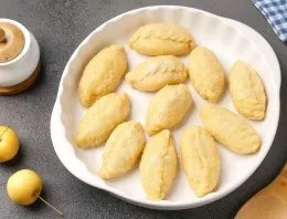 Transfer the blanks to an oiled heat-resistant form. Coat the top of the dough with milk and sprinkle with sugar. We bake in an oven preh...