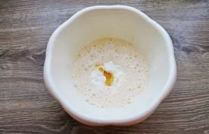 Add honey to the bowl of eggs and sour cream. If it is solid, heat it slightly until it becomes liquid.