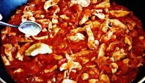 Add mustard and chicken broth to the pan.