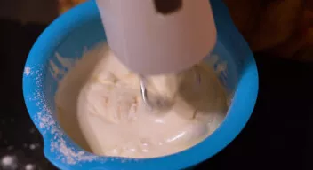 Gradually stir the dough and add flour.