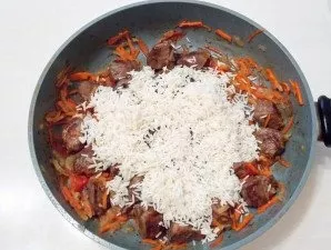 Add clean rice to the pan.