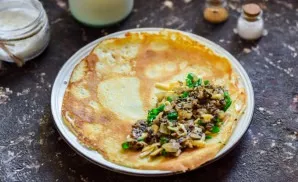 Spread the filling on the edge of the pancake.