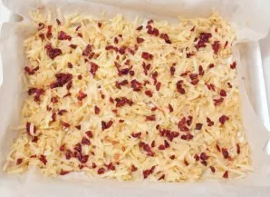 Distribute the blueberries evenly on the apple layer.