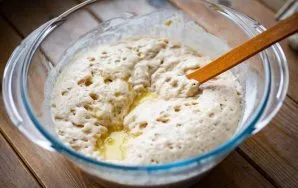 Pour this mixture into the dough and mix everything.