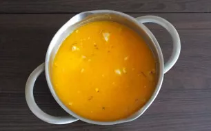 Add millet, potatoes, chopped boiled meat from ribs, fried onions and carrots to the broth with chopped pumpkin. Salt to taste and add pe...