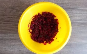 Make Filling before removing the dough from the fridge. In a bowl, mix the cranberries, sugar and dried cranberries. Crush with a hand bl...