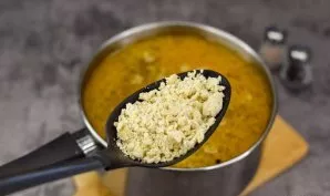 Now gradually pour the prepared mixture of flour and eggs into the soup. Bring the soup to a boil and add more porridge, controlling the ...