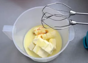 Beat soft butter with condensed milk and vanilla extract. Beat on low speed.