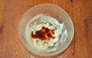 Add about half of the cooled sauce to the cream cheese and beat well. This will be the cream of our cake.