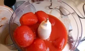 Grind the tomatoes in a blender.