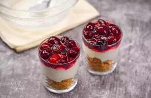 The last layer of dessert is cherry. This dessert can be served immediately after preparation.
