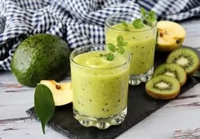 Avocado, kiwi and celery cocktail with apple juice