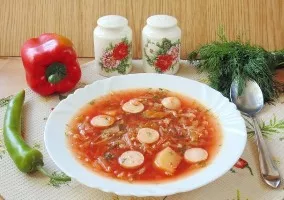 Borscht with young cabbage and sausages