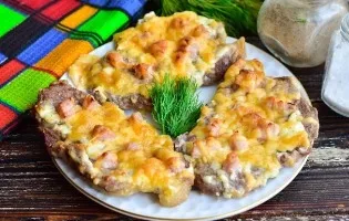 Pork with ham and cheese in the oven