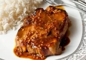 Pork steak with orange mustard sauce