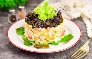 Crab salad with cheese and olives