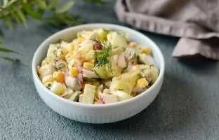 Salad with corn, mushrooms and cucumbers