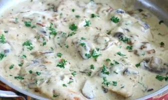 Chicken fillet with mushrooms in creamy sauce